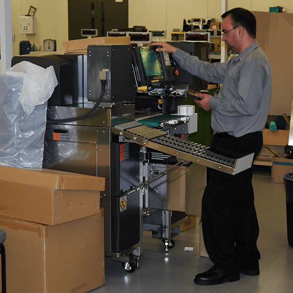 Wedderburn service and maintenance staff repairing equipment